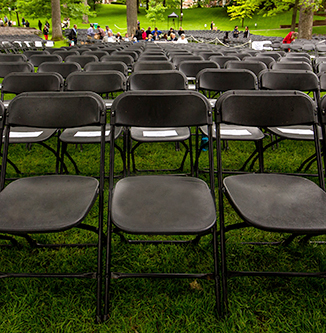 Folding chairs on the quad for graduation.